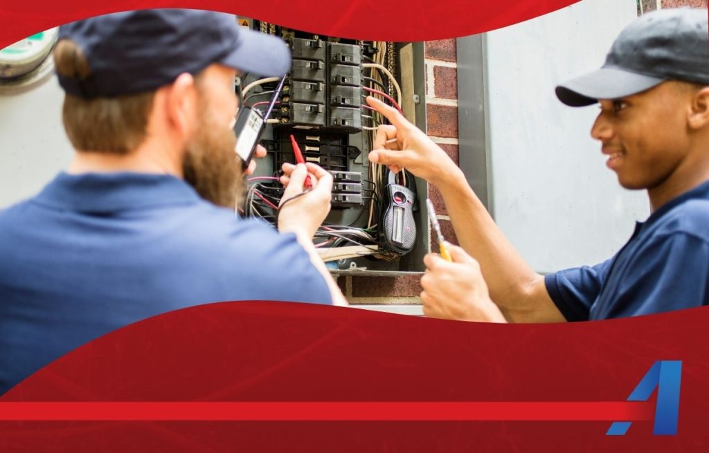 This is an image of two electricians working on a fuse box.