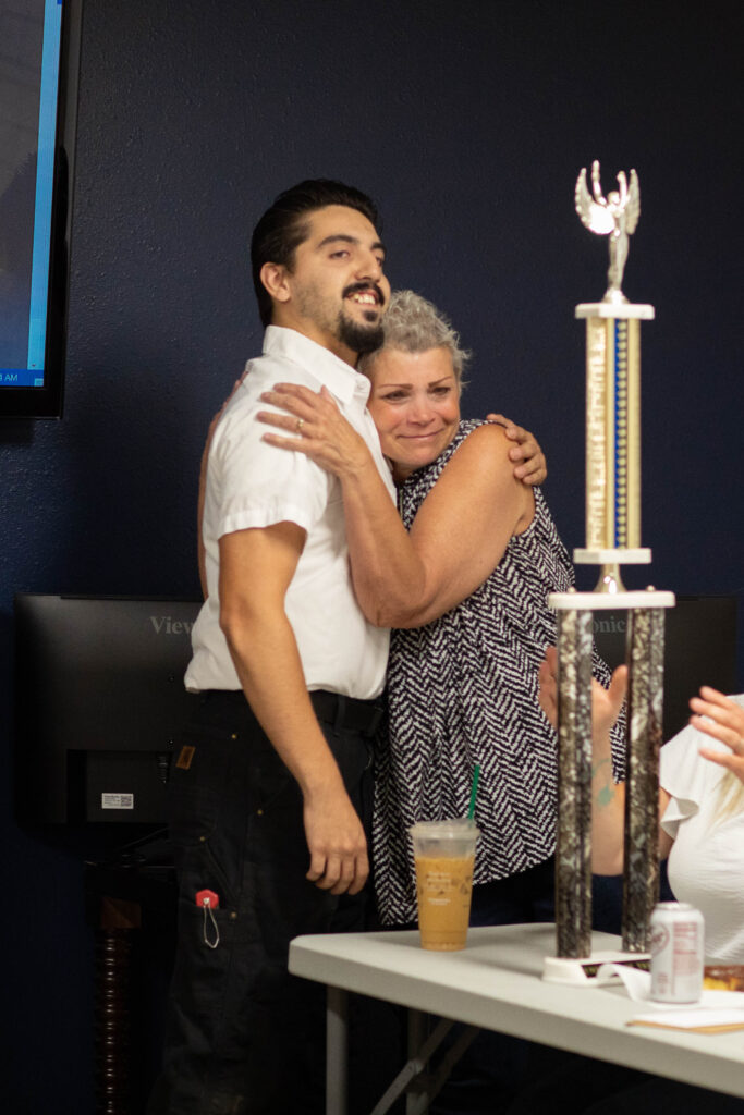 July Employee of the Month, Darius, chose and passed the torch to our August Employee of the month, Debbie at Associated Heating